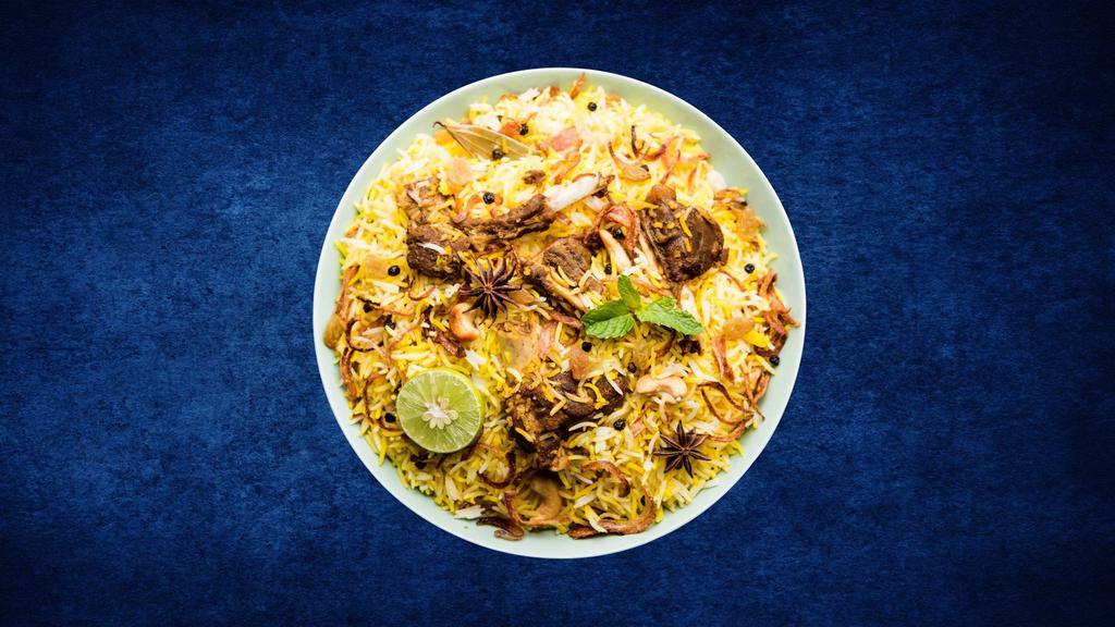Lamb Deluxe Biryani · Boneless lamb chunks cooked in a special biryani masala curry, layered with imported long grain rice and steamed till cooked and smoked with coal