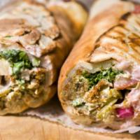 Chicken Shawarma · Marinated thinly sliced chicken slow roasted on a vertical rotisserie. Make a combo for an a...