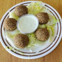 Falafel · Fried ground chick peas served on a flatbread with your choice of toppings. Make a combo for...
