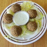 Falafel 5 Pcs (V) · Crispy balls of chick peas, herbs, and spices. Prepared fresh daily.