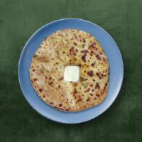 Cottage Cheese Paratha  · Unleavened whole wheat, savory shredded cottage cheese-stuffed flatbread