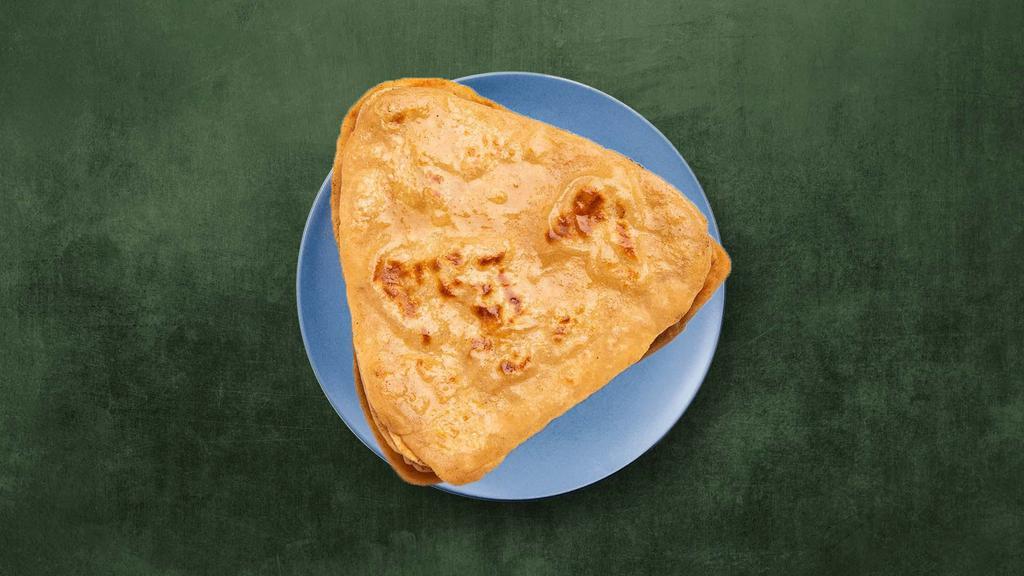 Plain Paratha · Unleavened whole wheat flatbread, baked in an Indian clay tandoor.