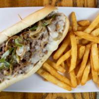 Philly Cheesesteak With Fries · 6oz sub sandwich made with super thinly sliced ribeye steak, caramelized onion, and provolon...