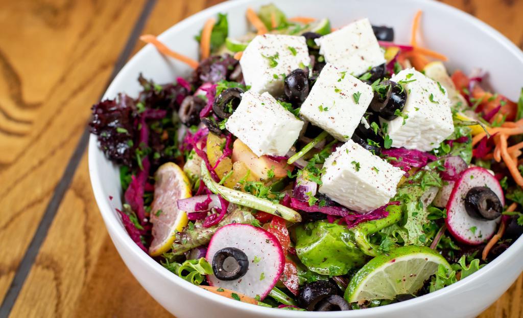 Greek Salad (V) · Cucumber, tomatoes, red onions, feta cheese and kalamata olives with a vinaigrette of garlic, oregano, vinegar, and olive oil.
