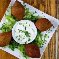 Lebanese Beef Croquettes (Kibbeh) · Ground beef, groats, onions, Pine nuts, made into balls and deep fried.