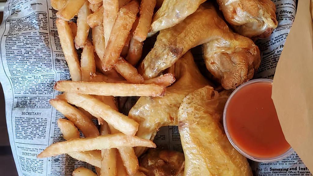 Whole Chicken Wings (10 Pieces) With Fries · Deep-fried un-breaded whole chicken wings seasoned with lemon pepper. Served with fries and a side of BBQ sauce or hot sauce.