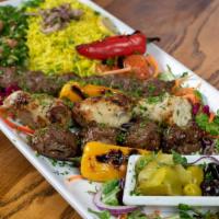 Mixed Grill Platter · One skewer each of chicken kabab, lamb kabab and kofta kabab. Served with rice and a side of...