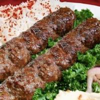 Iraqi Kofta Kabab Plate · Iraqi Kofta kabab mixed with parsley onion, and garlic. Served with rice, and a side of salad