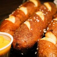 Pretzels · Soft hot Bavarian pretzel sticks salted and served with our famous cinnamon butter or cheese...