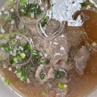 Rare Beef Pho · Traditional beef soup with rice noodle served with a side of bean sprouts, Thai basil, jalap...
