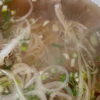 Combination Pho · Meatball, Rare  beef, tendon and brisket. Traditional beef soup with rice noodle served with...