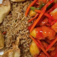 Sweet And Sour Chicken · Deep-fried breaded chicken in red sweet and sour sauce with pineapple chunks carrots and bel...