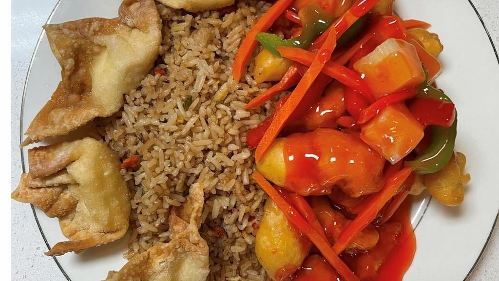 Sweet And Sour Chicken · Deep-fried breaded chicken in red sweet and sour sauce with pineapple chunks carrots and bell peppers