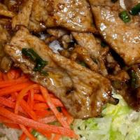 Com Thịt Nướng  (Pork) · Pork. Steamed rice with lettuce, cilantro, cucumber, pickled carrots and daikon with a side ...