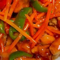 Sweet And Sour Chicken · Deep fried breaded chicken in red sweet and sour sauce with  carrots, and bell peppers.