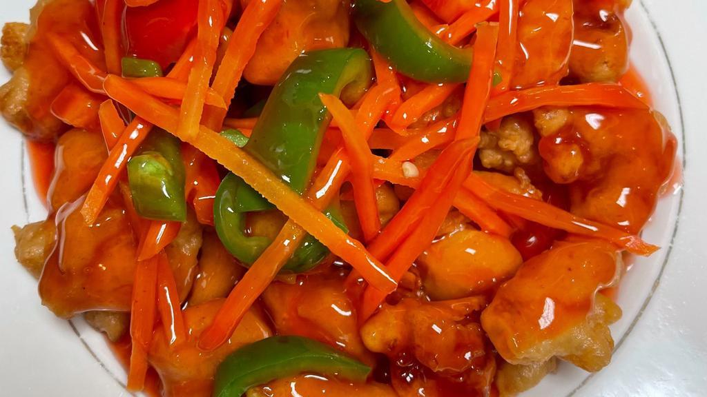 Sweet And Sour Chicken · Deep fried breaded chicken in red sweet and sour sauce with  carrots, and bell peppers.