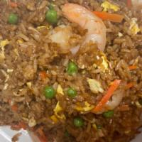 Shrimp Fried Rice · Stir-fried rice with eggs peas and carrots.
