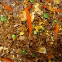 Beef Fried Rice · Stir-fried rice with eggs peas and carrots.