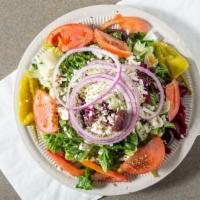 Authentic Greek Salad · Feta, beets, pepperocini, red onions, tomato, cucumber, olives, and dressing.