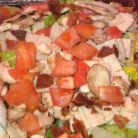 Cobb Salad · Fresh roasted turkey, bacon, tomatoes, mushrooms, crumbled bleu cheese, hard boiled egg and ...
