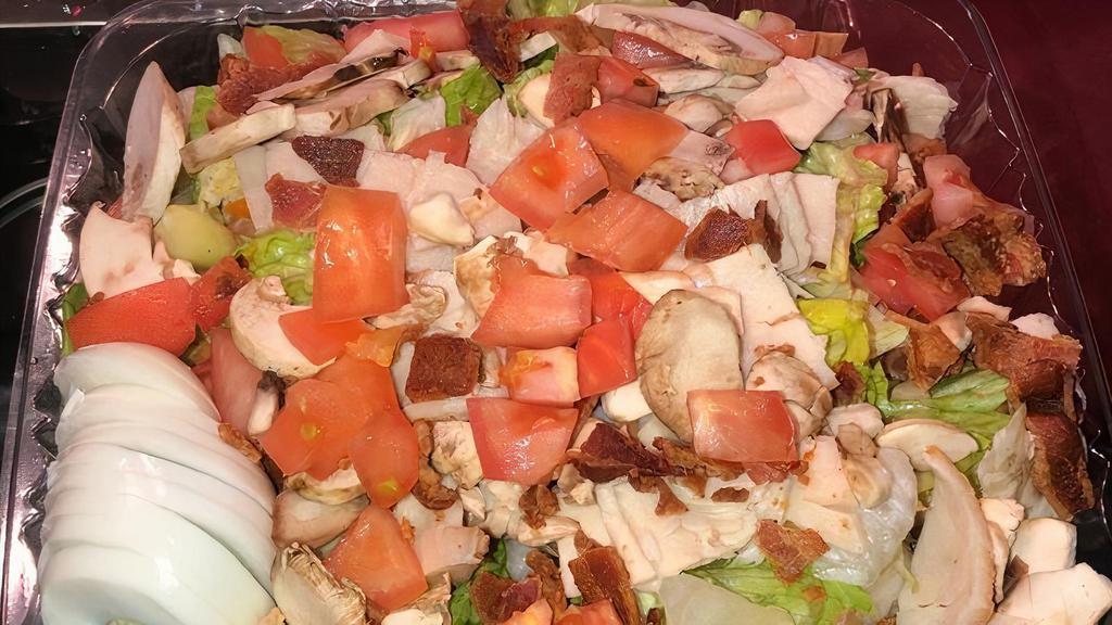 Cobb Salad · Fresh roasted turkey, bacon, tomatoes, mushrooms, crumbled bleu cheese, hard boiled egg and choice of dressing.
