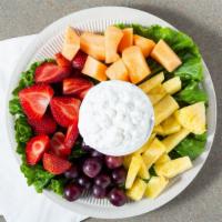 Low-Fat Cottage Cheese And Fresh Fruit Platter · scoop of cottage cheese with fresh strawberries, bananas, grapes, pineapple, and cantaloupe.