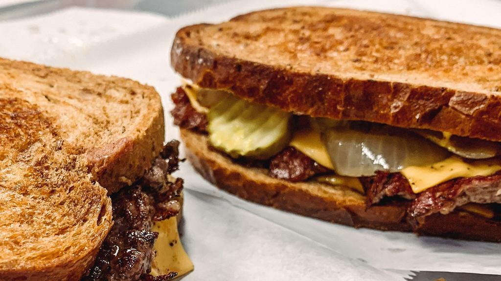 Smashy Melt · This sandwich includes the same goodness of a Smash Burger, but with a little twist! The Smashy Melt comes with 2 burger patties, double cheese, grilled onions, mustard and pickle chips all on Rye Bread!

Fries NOT included.