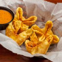 Crab Puff · Fried wonton fill with delicious cream cheese, crab meat, and seasonings. So warm, the filli...