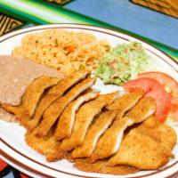 Milanesa Dinner · Breaded steak or chicken breast served with guacamole, rice, beans, salad and your choice of...