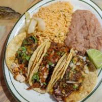 Taco Dinner · Three tacos in soft corn or flour tortilla filled with your choice of meat, onions, cilantro...