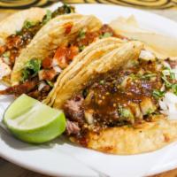 Tacos A La Carte · A soft corn or flour tortilla filled with your choice of meat, onions, cilantro, and hot sau...