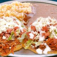 Tostada Dinner · Two tostadas of your choice served with rice and beans on the side.