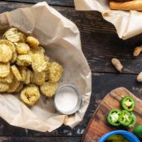 Fried Pickles · Basket of hand-breaded pickle chips deep-fried to a golden brown and served with homemade Ch...