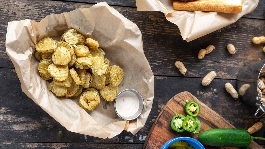 Fried Pickles · Basket of hand-breaded pickle chips deep-fried to a golden brown and served with homemade Chipotle Bacon Ranch dressing.