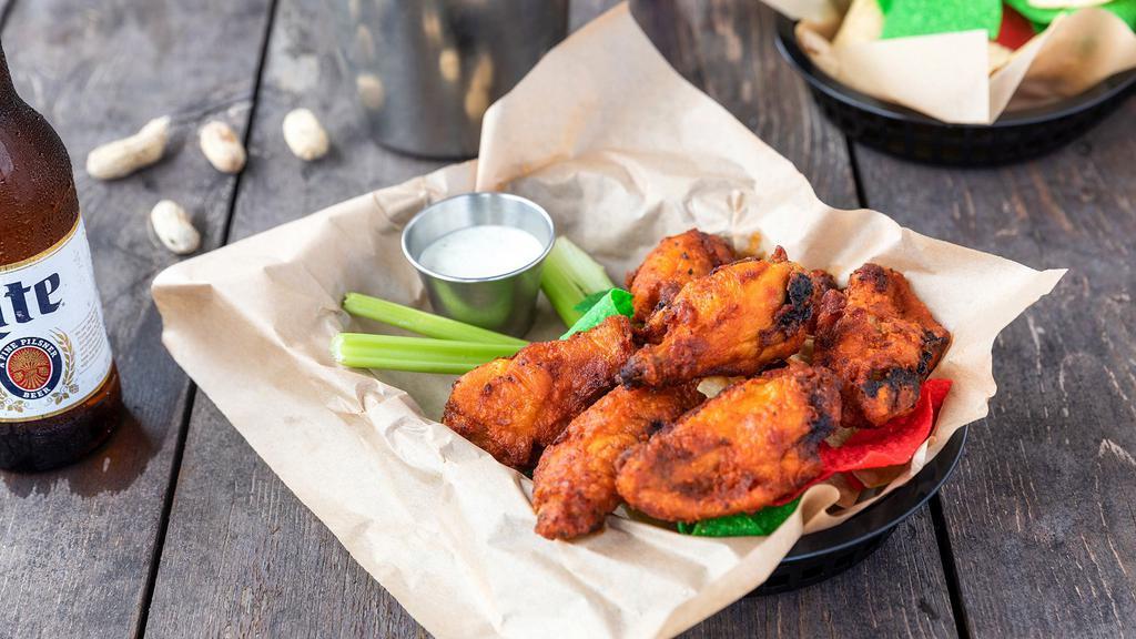 Smokin’ Wings · 1 lb. of wings with your choice of tossed in Spicy Buffalo or Chipotle BBQ wing sauce. Served with you choice of Blue Cheese, Ranch, or Chipotle Bacon Ranch dressing.