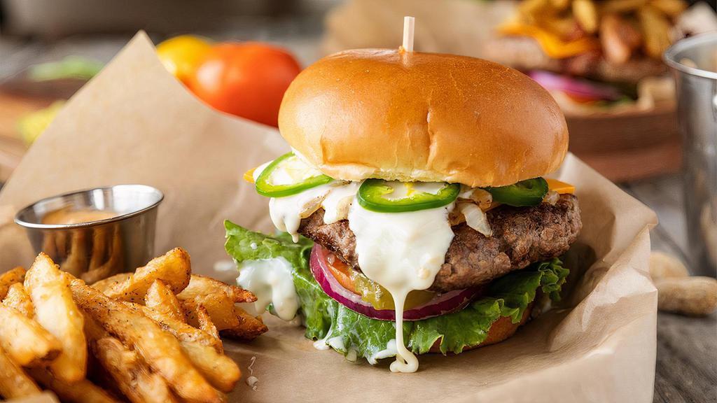 The Original “Death Burger” · Our hickory grilled burger topped with pickle, lettuce, tomato, queso blanco, onions, jalapeños and cheddar cheese.