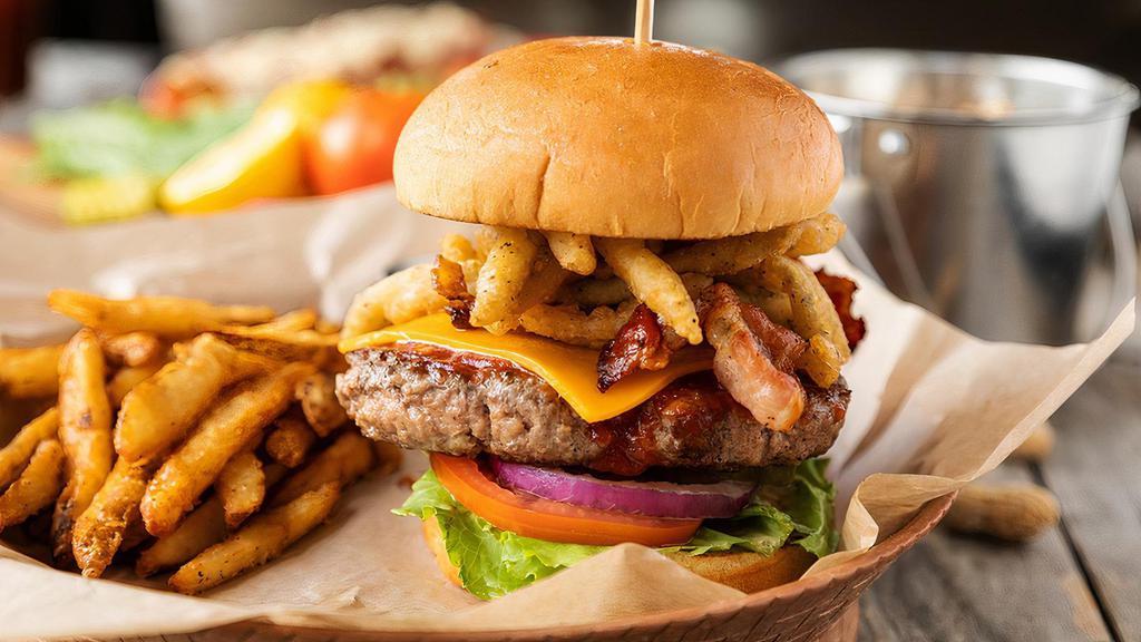 Goodtime Burger · Colt ford's very own 1/2 pound burger basted with chipotle BBQ sauce and piled high with smoked bacon, cheddar cheese, chipotle mayo, and fried jalapeños and onions served with crisp lettuce, fresh tomatoes, pickles, onions, and a side of fries.
