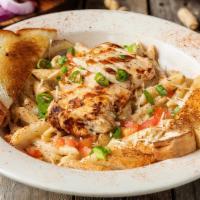 Southwest Chicken Pasta · Hickory grilled chicken served over penne pasta, topped with fresh tomatoes, green onions, a...
