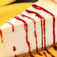 Original Ny Cheesecake · Deliciously decadent cheesecake drizzled with your choice of caramel, raspberry or chocolate.