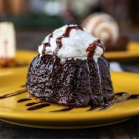 Chocolate Molten Cake · Warm chocolate cake drenched with dark chocolate. Topped with vanilla ice cream.