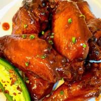 Black Sriracha Bbq · Sweet and spicy, our favorite combo. Uncle Dougie's signature black sriracha sauce, the flav...