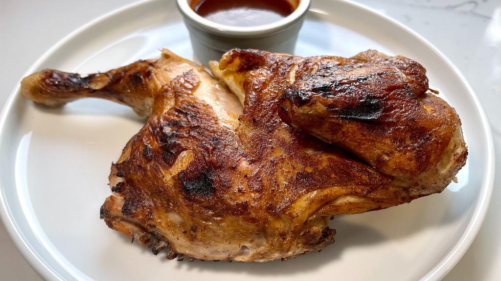 Roasted Chicken Dinner · Half broasted chicken finished on the grill and served with a side salad. Choice of wing sauce or rub.