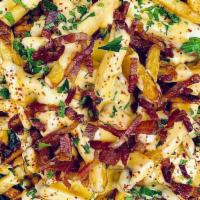 Loaded Fries · Crispy French fries topped with our five-cheese sauce, crispy bacon pieces, and chives.