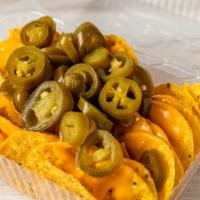 Nachos · Nacho Chips topped with Nacho Cheese and Jalapenos