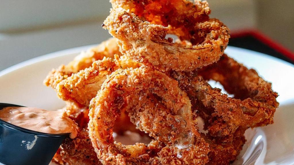 Onion Rings · Jumbo hand-breaded onion rings full of crunch and flavor served with Horseradish Cream or Russian Dressing.