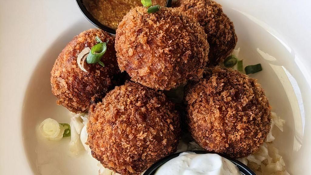 Sausage Balls · Bratwurst, Cleveland Kraut, Cream Cheese, & Spices deep-fried into balls!  Served on a bed of Cleveland Kraut with a side of Sweet Chili Mustard & Horseradish Cream.