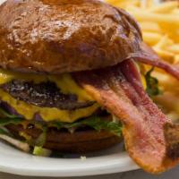 Griddle Burger · double patty, American cheese, lettuce, tomato, onion, pickle, remoulade, brioche bun.