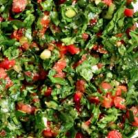Tabouli Salad · Chopped parsley, green onions, tomatoes. Mixed with cracked wheat, lemon and olive oil.