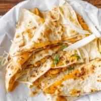 Quesadilla · Cooked tortilla that is filled with cheese and folded in half.