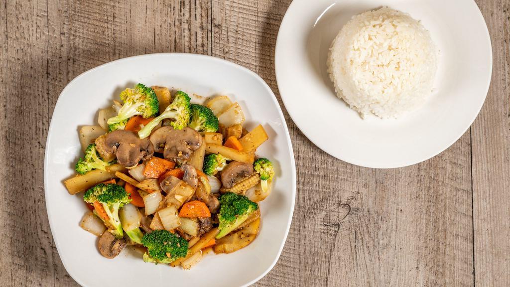#11 Stir Fry Vegetables · Broccoli, Chinese broccoli, carrot, baby corn, onion, mushroom, and bamboo served with rice on the side.